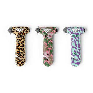 Three colorful patterned emergency escape hammers with glass breaker tips and seatbelt cutters displayed on white background.