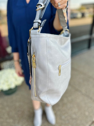 The Whipstitch Handbag w/ Guitar Strap