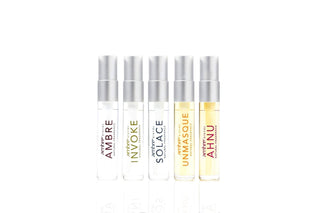 Five Ambre Blends perfume bottles with silver caps in a row, featuring different scent varieties.