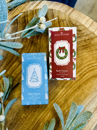 Royal Standard vanilla scented bath fizzers in festive Christmas packaging on wooden surface with decorative foliage