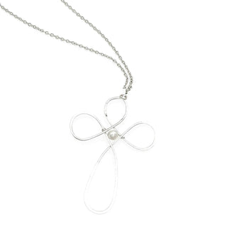 Silver wire cross pendant necklace with pearl center accent on delicate chain, white background.
