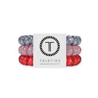 TELETIES hair ties in various colors displayed in clear packaging with brand logo