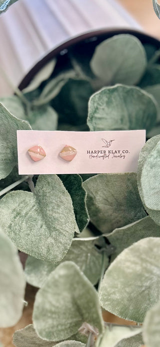 Blush Horizon Stud Earrings displayed on Harper Klay Co. branded card surrounded by green eucalyptus leaves