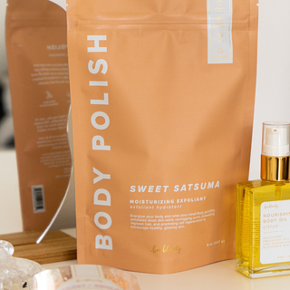 Orange packaging of Bonblissity Sweet Satsuma body polish moisturizing exfoliant with nourishing body oil bottle