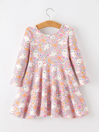 Girls long-sleeve floral twirl dress with bunny print displayed on wooden hanger against white background.