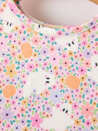 Rylee Faith Designs girls dress with pastel floral and pumpkin print on white fabric.