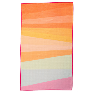 Colorful gradient kitchen towel with warm sunset hues of orange, yellow, pink and gray stripes.