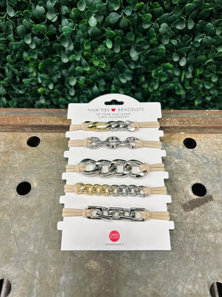 Set of five chain-link hair tie bracelets in metallic finishes displayed on white packaging card.