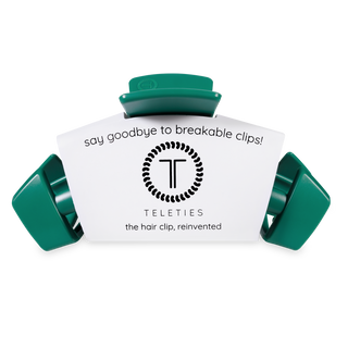 TELETIES hair clips in green color with product packaging showing "say goodbye to breakable clips" messaging.