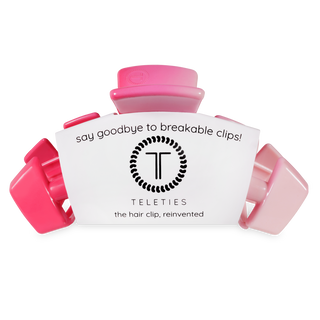 Pink TELETIES hair clips in packaging with "say goodbye to breakable clips" text
