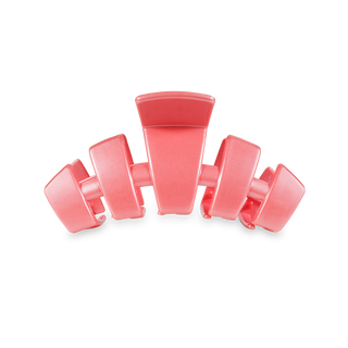 Pink hair clip with curved design and secure grip mechanism for medium hair styling