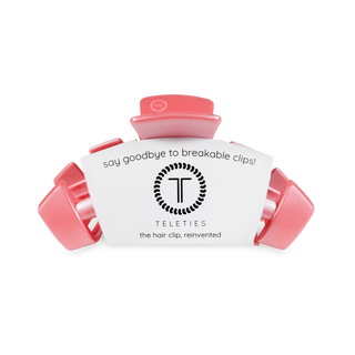 TELETIES spiral hair clips in coral color with white packaging displaying brand logo and tagline