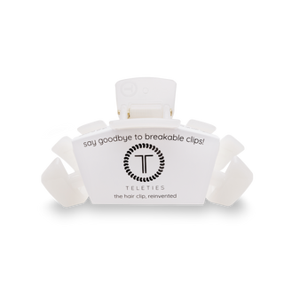 TELETIES hair clip in white packaging with brand logo and "say goodbye to breakable clips" text