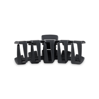 Classic hair clip with curved teeth design in dark matte finish on white background