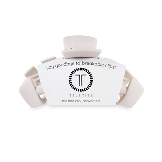 TELETIES hair clips in white packaging with brand logo and "say goodbye to breakable clips" text