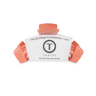 TELETIES hair clips in coral color with packaging that says "say goodbye to breakable clips