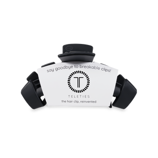 TELETIES hair clips in black color with product packaging showing "say goodbye to breakable clips" text