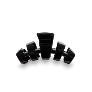 Black hair claw clip with curved teeth design shown from front angle