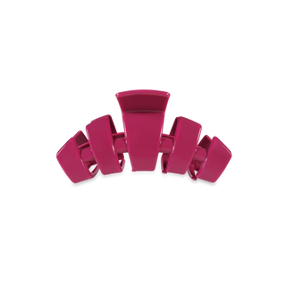 Pink transparent hair claw clip with curved teeth design on white background