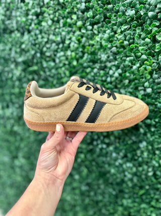 Corkys Heads Up Sneaker in suede with black stripes, gum sole, and leopard heel detail.