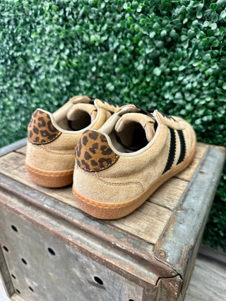Corkys Heads Up Sneaker featuring suede upper, black stripes, leopard print heel tab, and gum sole.