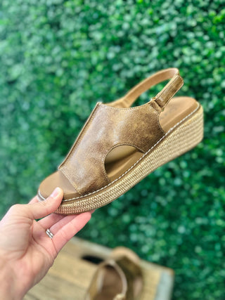 Corkys Volta 2 wedge sandal with leather upper, cutout detail, and woven platform sole.