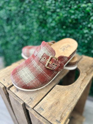 Corky's Day Dream plaid patterned slip-on slides with buckle detail on wooden crate outdoors