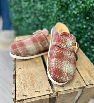 Corky's Day Dream plaid slip-on slides with buckle detail displayed on wooden crate outdoors