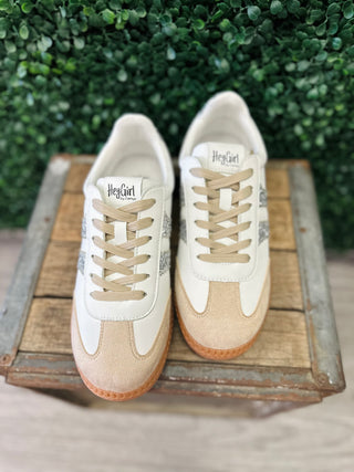 Corkys Hey Girl Heads Up Sneaker with glitter stripe detail displayed on rustic wooden crate.