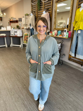 Woman wearing Haptics Cozy & Collected Striped Hoodie Top with wooden buttons and front pockets.