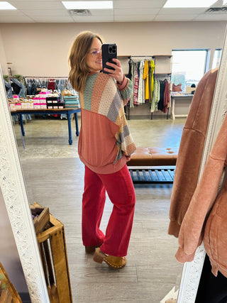 Woman wearing Haptics Cozy & Collected Striped Top with wide-leg pants in boutique mirror selfie.
