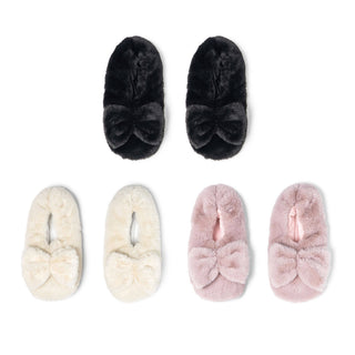 Three pairs of fuzzy slippers with bow details in different colors displayed on white background