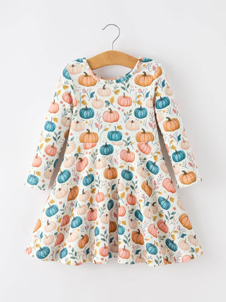 Girls' long-sleeve twirl dress featuring colorful pumpkin and autumn leaf print, displayed on hanger.
