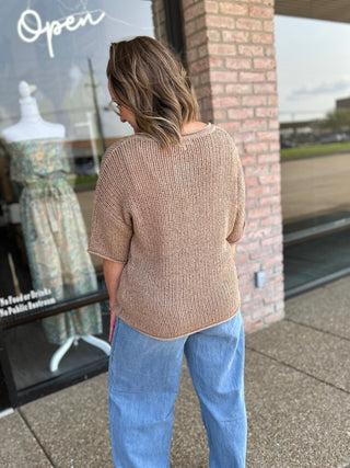 Woman modeling Blu Pepper Desert Dream Crochet Top with short sleeves, paired with jeans, back view.