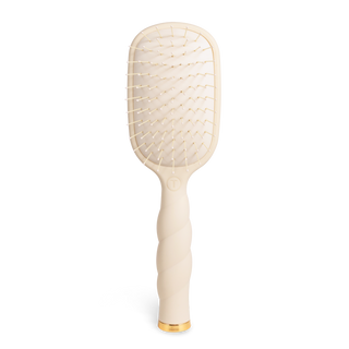 TELETIES detangler hair brush with flexible bristles and ergonomic handle on white background