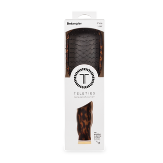 TELETIES detangler hair brush with tortoise shell pattern in white retail packaging