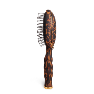 TELETIES detangler hair brush with tortoiseshell pattern handle and fine bristles for gentle detangling.