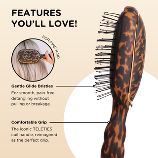 TELETIES detangler hair brush with tortoise pattern showing gentle bristles and comfortable grip handle design.
