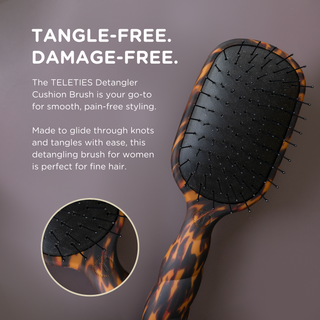 TELETIES detangler hair brush with tortoise shell pattern handle and black bristled cushion pad