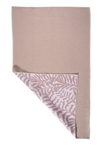 Driftwood kitchen towel with corner folded back showing tropical leaf pattern on reverse side