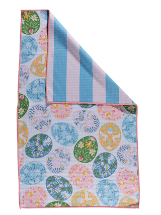 Colorful kitchen towel with floral egg pattern on one side and blue striped pattern on reverse side