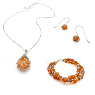 Orange gemstone jewelry set featuring necklace, earrings, and beaded bracelet with silver accents