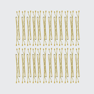 Collection of blonde bobby pins arranged in neat rows showing their wavy design and rounded tips