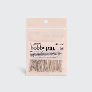 Package of blonde bobby pins with clear plastic window showing the hair accessories inside