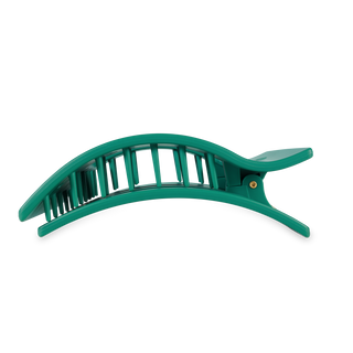 Green flat rectangle hair clip with curved design and vertical ridged pattern.