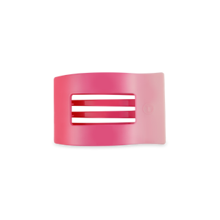 Pink translucent rectangular hair clip with rounded corners and ventilation slots on black feet