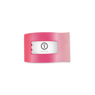 Pink TELETIES flat rectangle hair clip with silver logo plate on white background