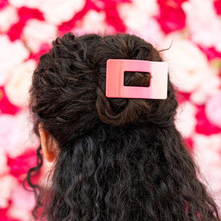 TELETIES flat rectangle hair clip securing dark curly hair in updo hairstyle