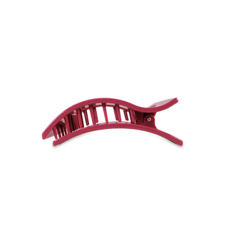 Pink rectangular hair claw clip with curved design and teeth for securing hair