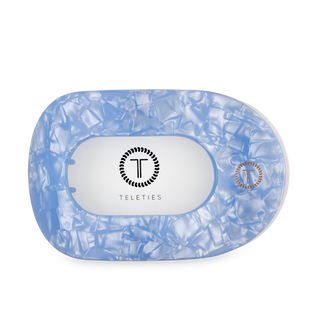 TELETIES flat round hair clip with textured translucent blue design on white background